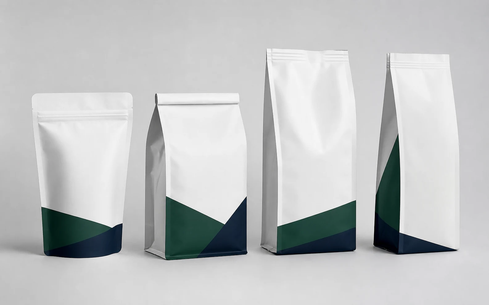 Stand-up, flat-bottom, quad-seal and side-gusset flexible packaging pouches
